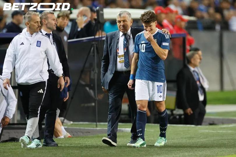 Arsenal's Injury Nightmare Continues as Tzolis Leaves the Pitch Clutching His Hamstring.