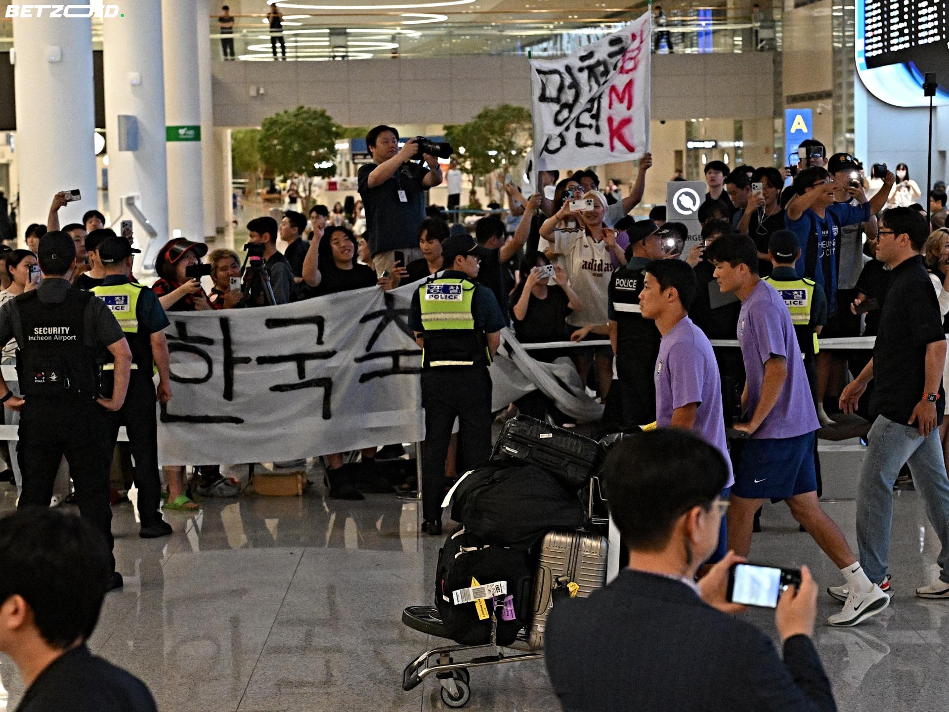 Riot Police, Dog Chews and Resignation Demands: South Korea's Ugly Homecoming.