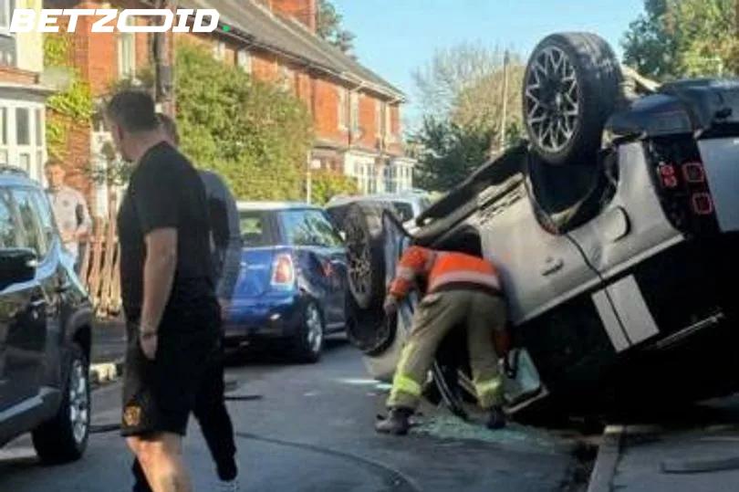 Sorba Thomas Walks Away Unhurt After Car Flips on Street Near Hull's Training Ground.